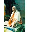 Prabhupada Smiling Sitting in Garden Chanting Japa