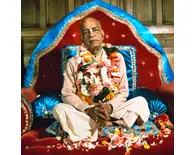 Srila Prabhupada in London on Red and Blue Vyasasana with Folded Hands