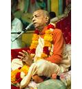 Prabhupada Giving Class in Los Angeles New Dwarka Temple with Folded Hands on Red Vyasasana