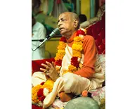 Prabhupada Giving Class in Los Angeles New Dwarka Temple with Folded Hands on Red Vyasasana