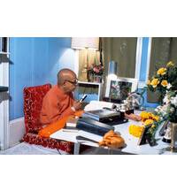 Srila Prabhupada Sitting at his Desk Translating Srimad-Bhagavatam
