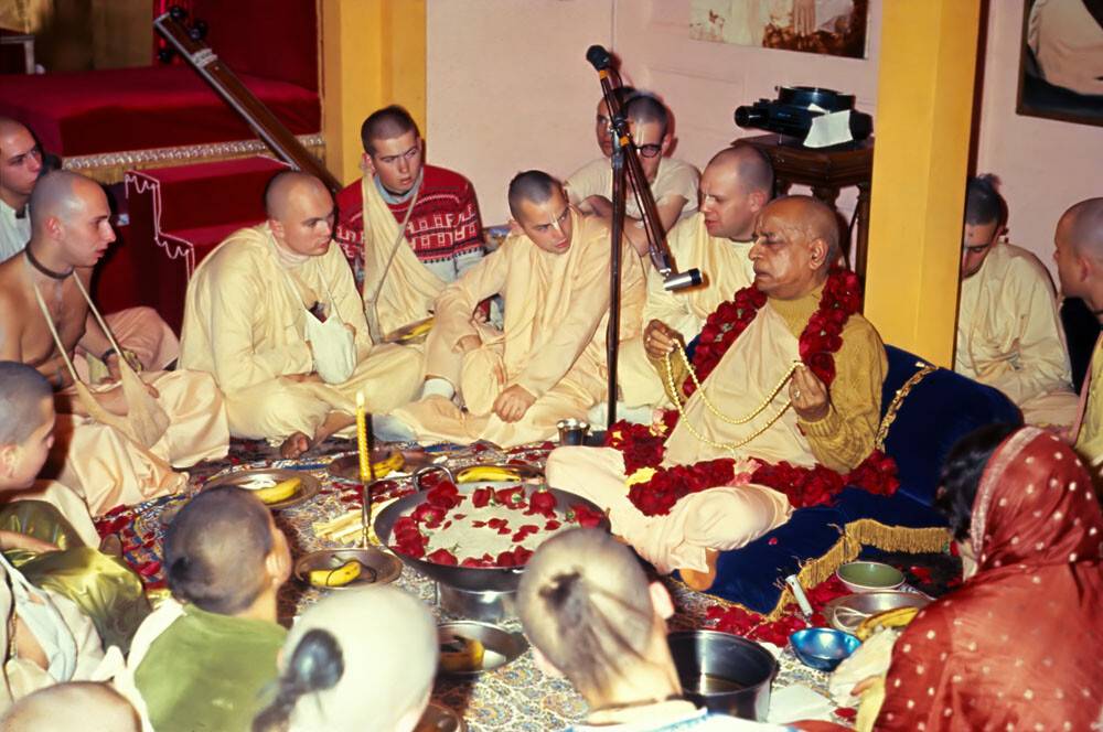 Prabhupada Sitting Around Fire Yajna Chanting on Devotees Beads