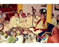 Prabhupada Sitting Around Fire Yajna Chanting on Devotees Beads