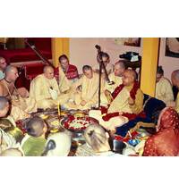 Prabhupada Sitting Around Fire Yajna Chanting on Devotees Beads
