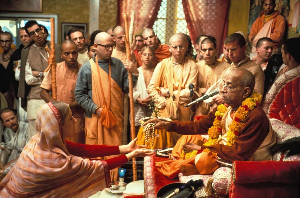Prabhupada Handing Japa Beads to Woman Devotee