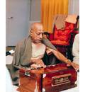 Srila Prabhupada Playing Harmonium