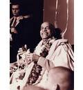 Srila Prabhupada sitting on Vyasasana with BIG smile