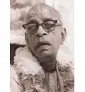 Srila Prabhupada with black glasses