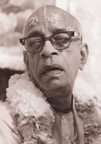 Srila Prabhupada with black glasses