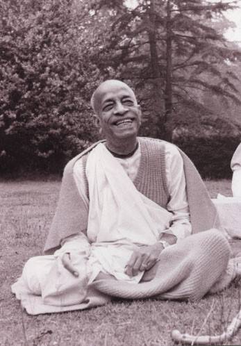 Srila Prabhupada sitting on lawn at Bhaktivedanta Manor London